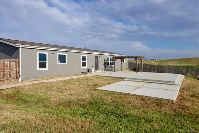 a view of house with yard and outdoor space