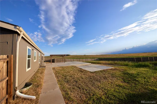 a view of a pathway with a yard