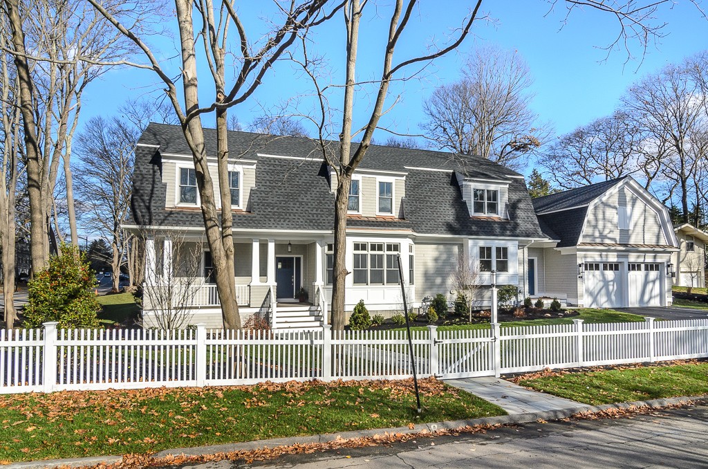 2 Leighton Road Wellesley, MA 02482 - Photo 1 of 16 a view of a brick house next to a yard with large trees
