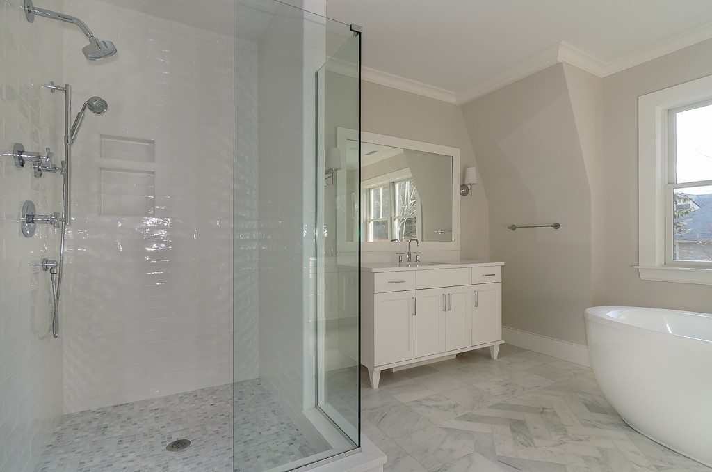 2 Leighton Road Wellesley, MA 02482 - Photo 12 of 16 a bathroom with a granite countertop sink a mirror and a bathtub