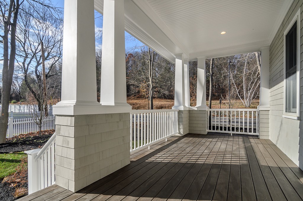 2 Leighton Road Wellesley, MA 02482 - Photo 2 of 16 a view of a porch with wooden floor and fence