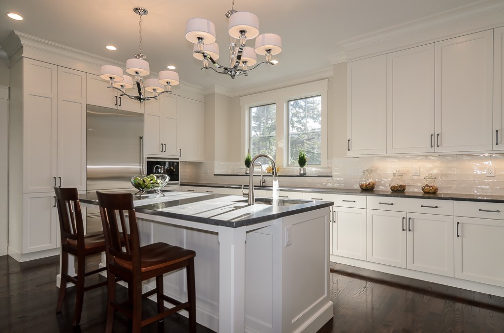 2 Leighton Road Wellesley, MA 02482 - Photo 6 of 16 a kitchen with cabinets a sink dishwasher with a dining table and chair