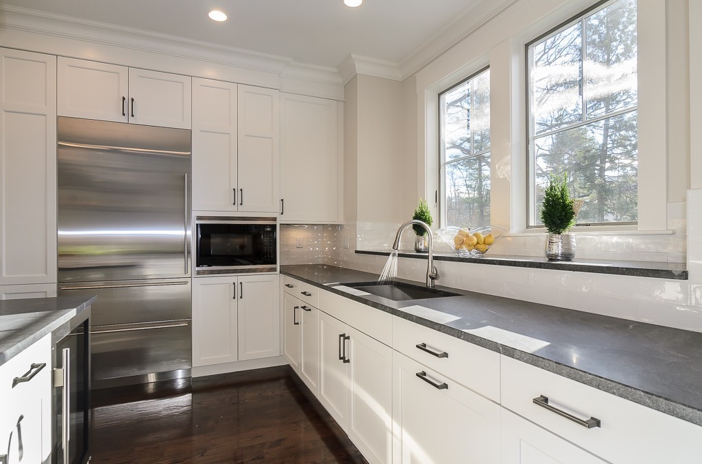 2 Leighton Road Wellesley, MA 02482 - Photo 7 of 16 a kitchen with granite countertop stainless steel appliances a sink and cabinets