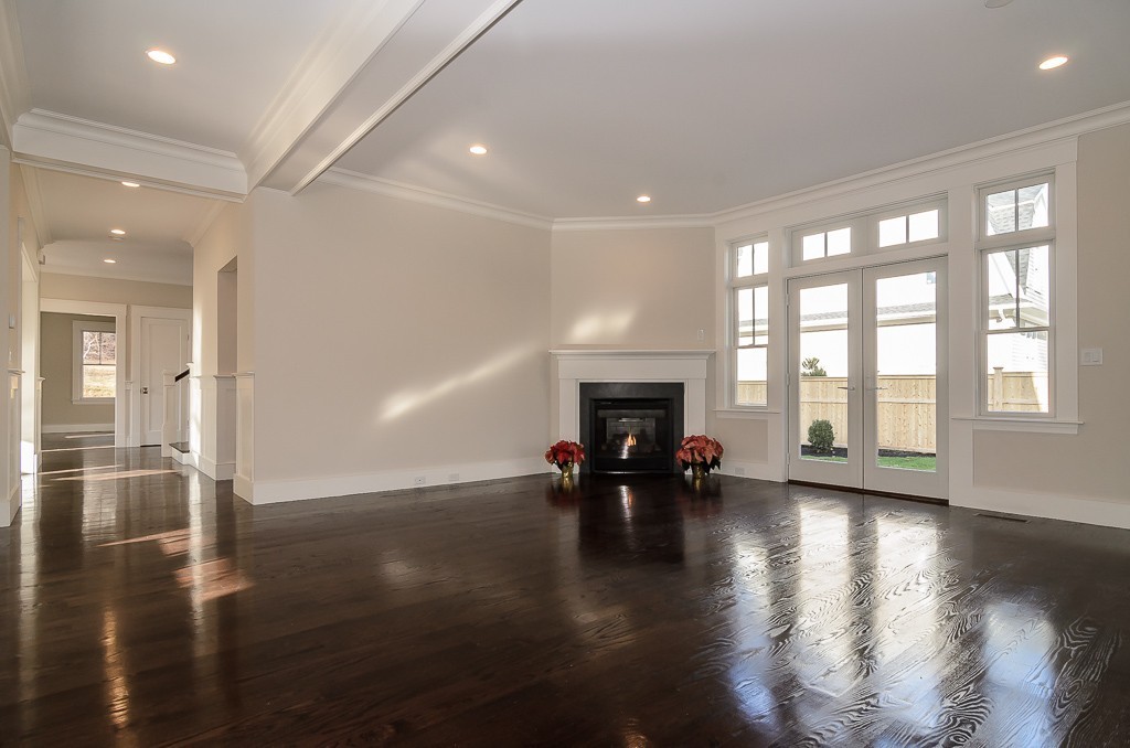 2 Leighton Road Wellesley, MA 02482 - Photo 10 of 16 an empty room with floor to ceiling window and wooden floor