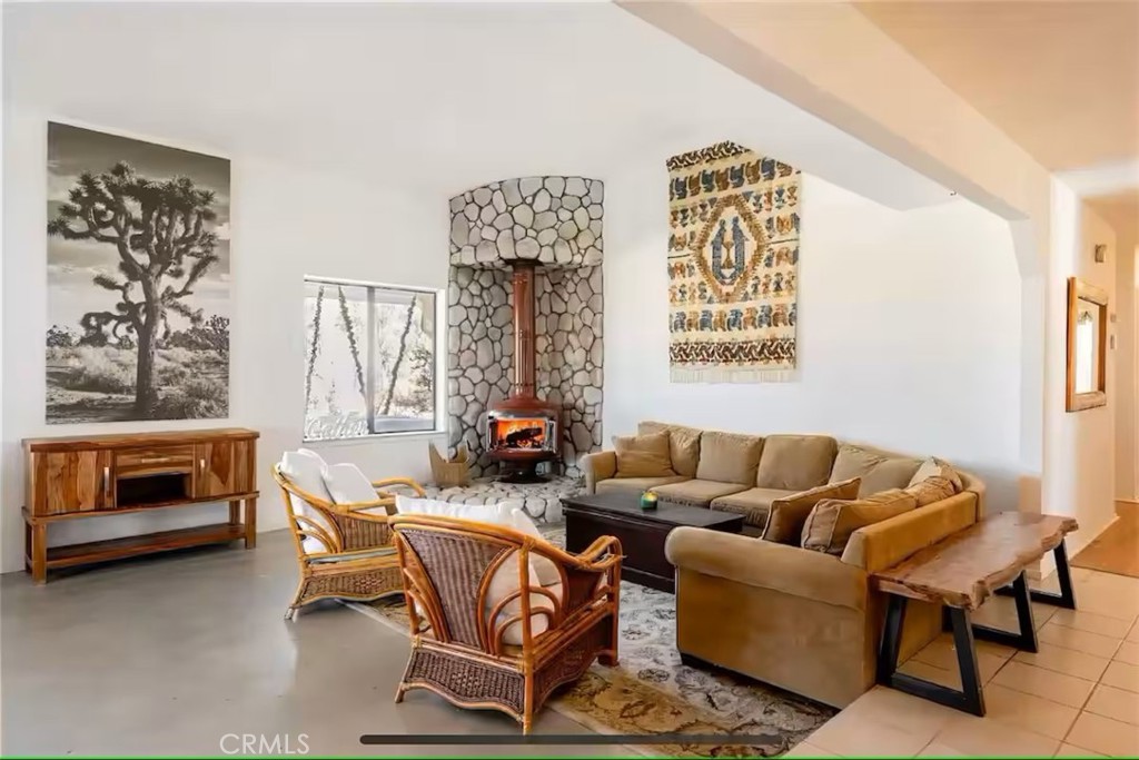 70138 Sullivan Road Twentynine Palms, CA 92277 - Photo 11 of 68 a living room with furniture a couch and a fireplace