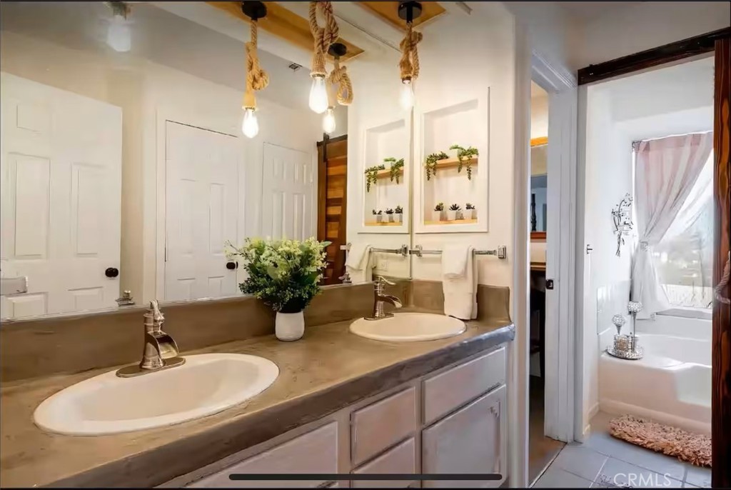 70138 Sullivan Road Twentynine Palms, CA 92277 - Photo 22 of 68 a bathroom with a sink and a mirror