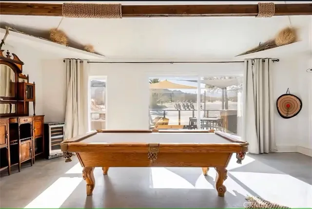 a view of a terrace with furniture and a table