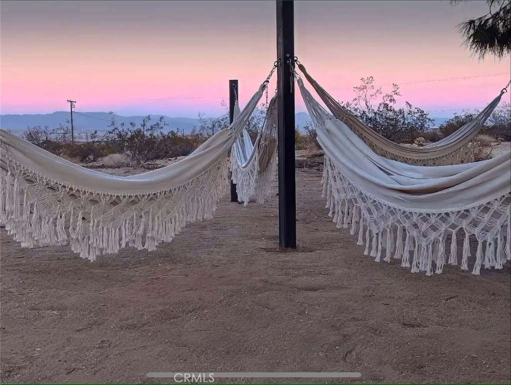 70138 Sullivan Road Twentynine Palms, CA 92277 - Photo 27 of 68 a view of a house with a balcony