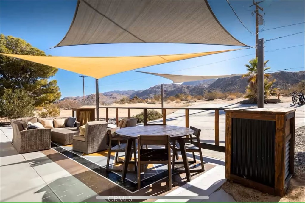70138 Sullivan Road Twentynine Palms, CA 92277 - Photo 28 of 68 a view of a terrace with furniture and a table