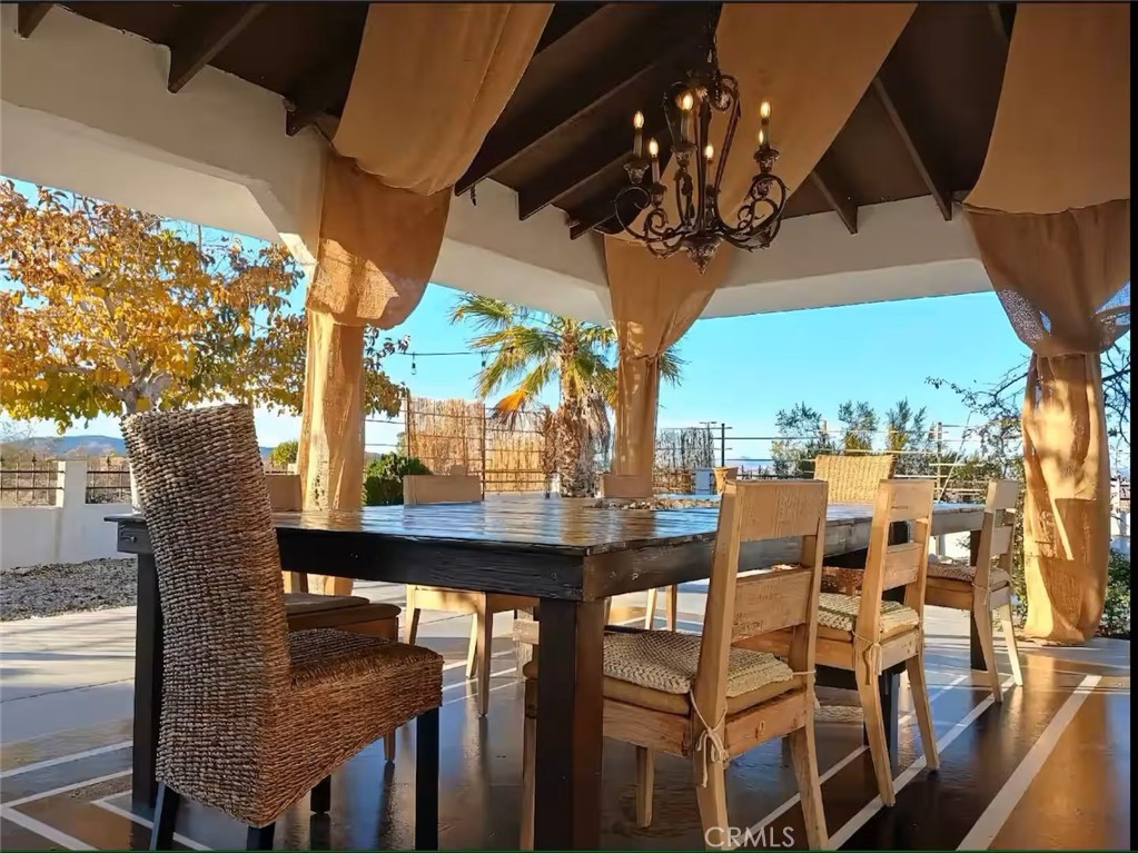 70138 Sullivan Road Twentynine Palms, CA 92277 - Photo 32 of 68 a view of a chairs and table in the patio