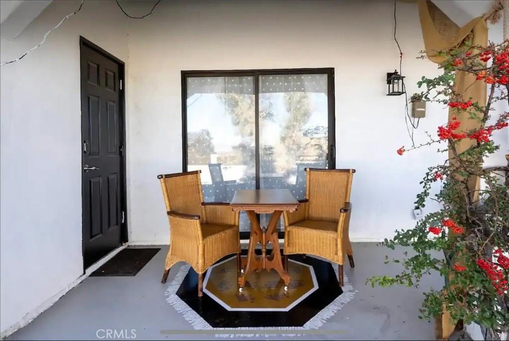 70138 Sullivan Road Twentynine Palms, CA 92277 - Photo 33 of 68 a view of a dining room with furniture window and flowerpot