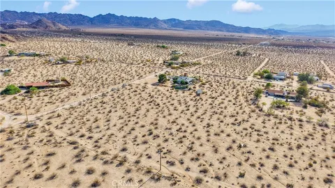 a view of a house with outdoor space and sitting area