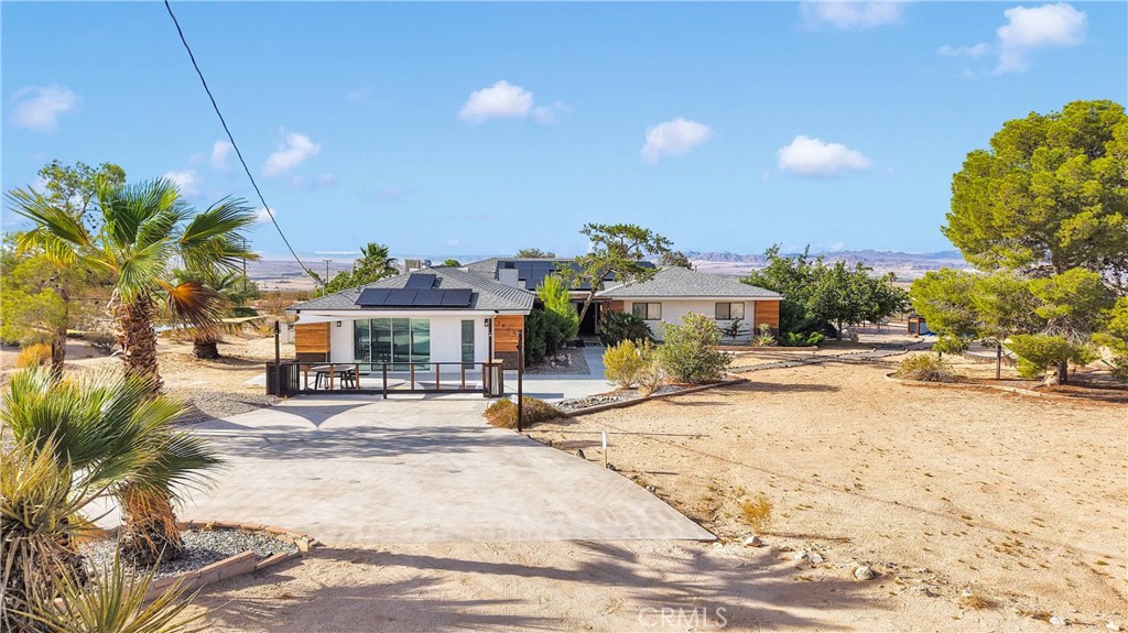 70138 Sullivan Road Twentynine Palms, CA 92277 - Photo 65 of 68 a view of a house with outdoor space and sitting area