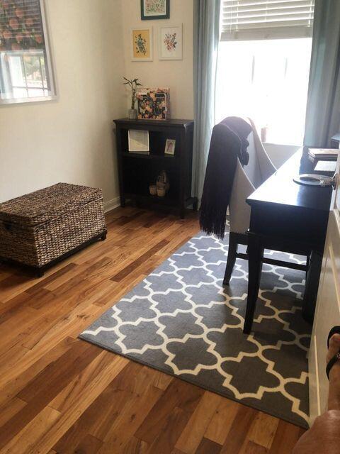 1836 Jeaga Drive Jupiter, FL 33458 - Photo 13 of 20 a bedroom with a bed and wooden floor