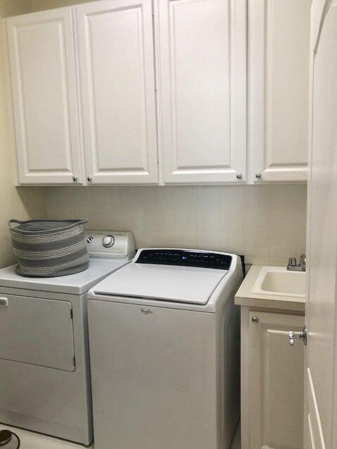 1836 Jeaga Drive Jupiter, FL 33458 - Photo 14 of 20 a utility room with dryer and washer