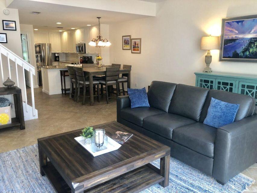 1836 Jeaga Drive Jupiter, FL 33458 - Photo 4 of 20 a living room with furniture and a dining table