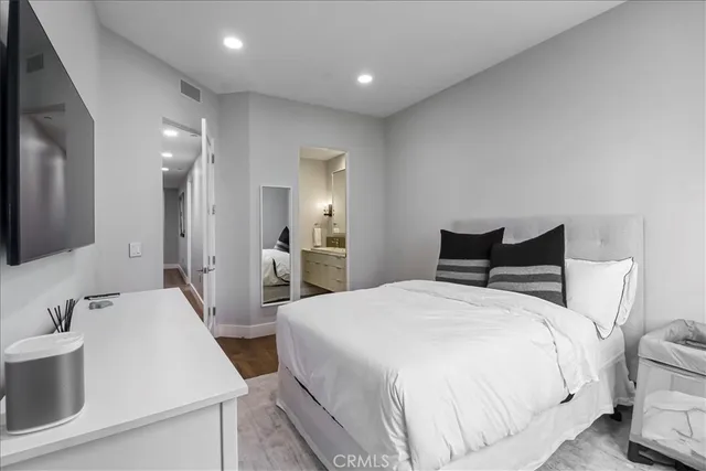 a bedroom with furniture and a window