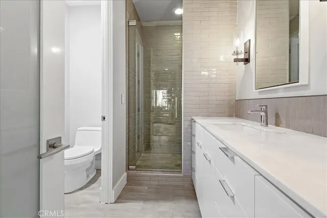 a bedroom with bed and window