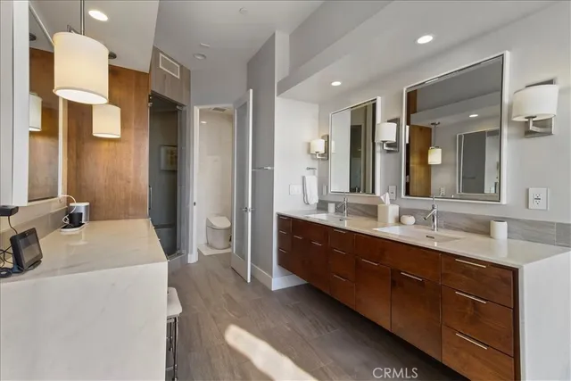 a large bathroom with a double vanity sink mirror and double