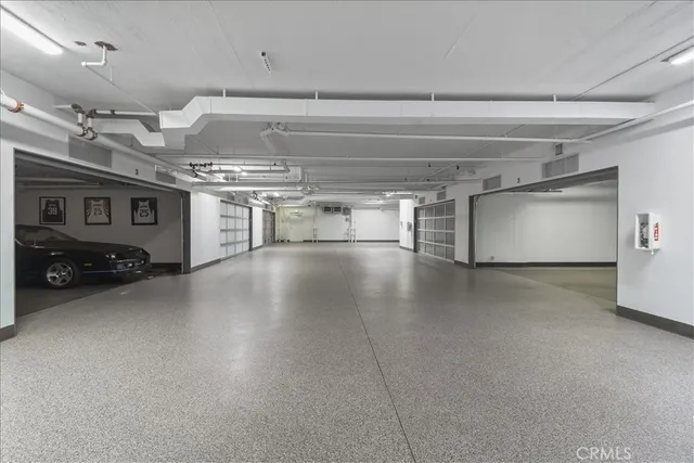an aerial view of residential building and car parked on street side