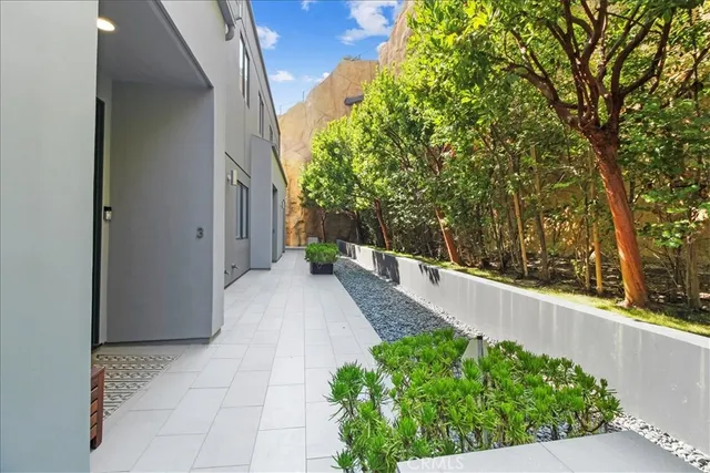 a large kitchen with kitchen island a stove a sink a refrigerator and a fireplace