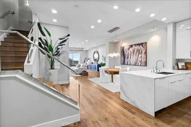 a view of a dining room with furniture and a chandelier