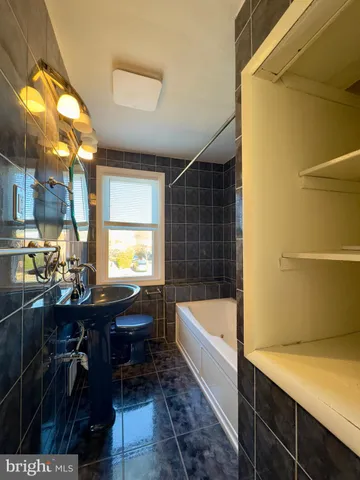 a kitchen with a sink and a window