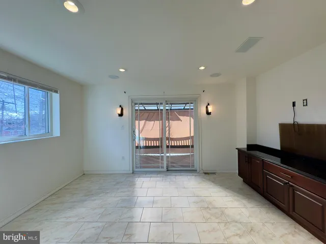 a view of workspace with furniture and window