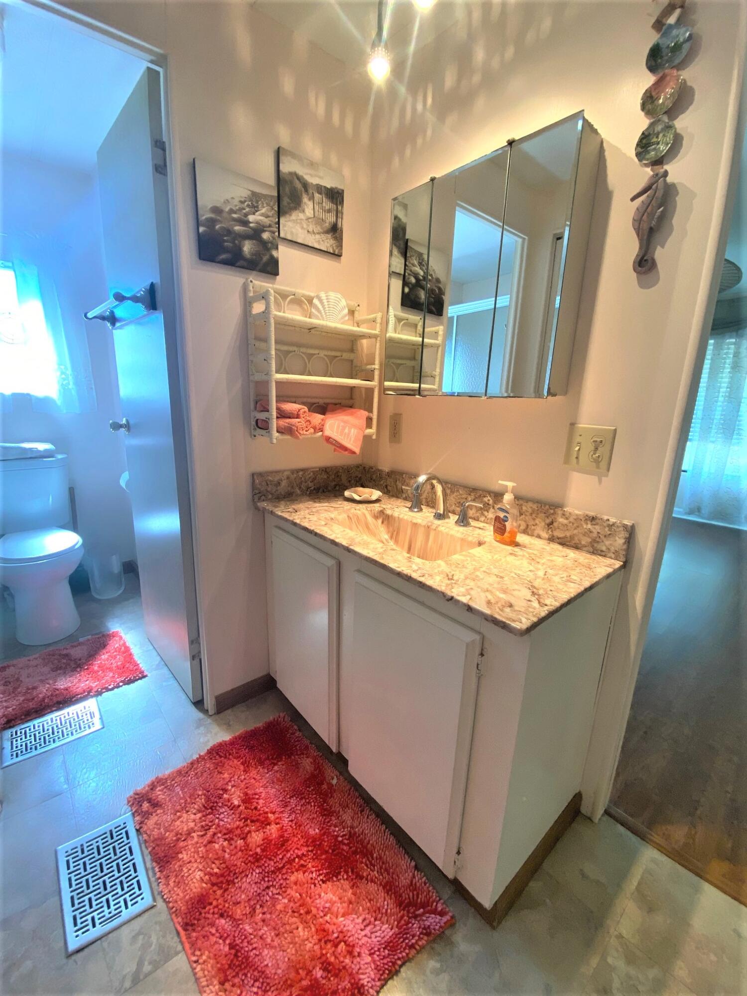 808 South Silver Circle Key Largo, FL 33037 - Photo 11 of 24 a bathroom with a sink and a mirror