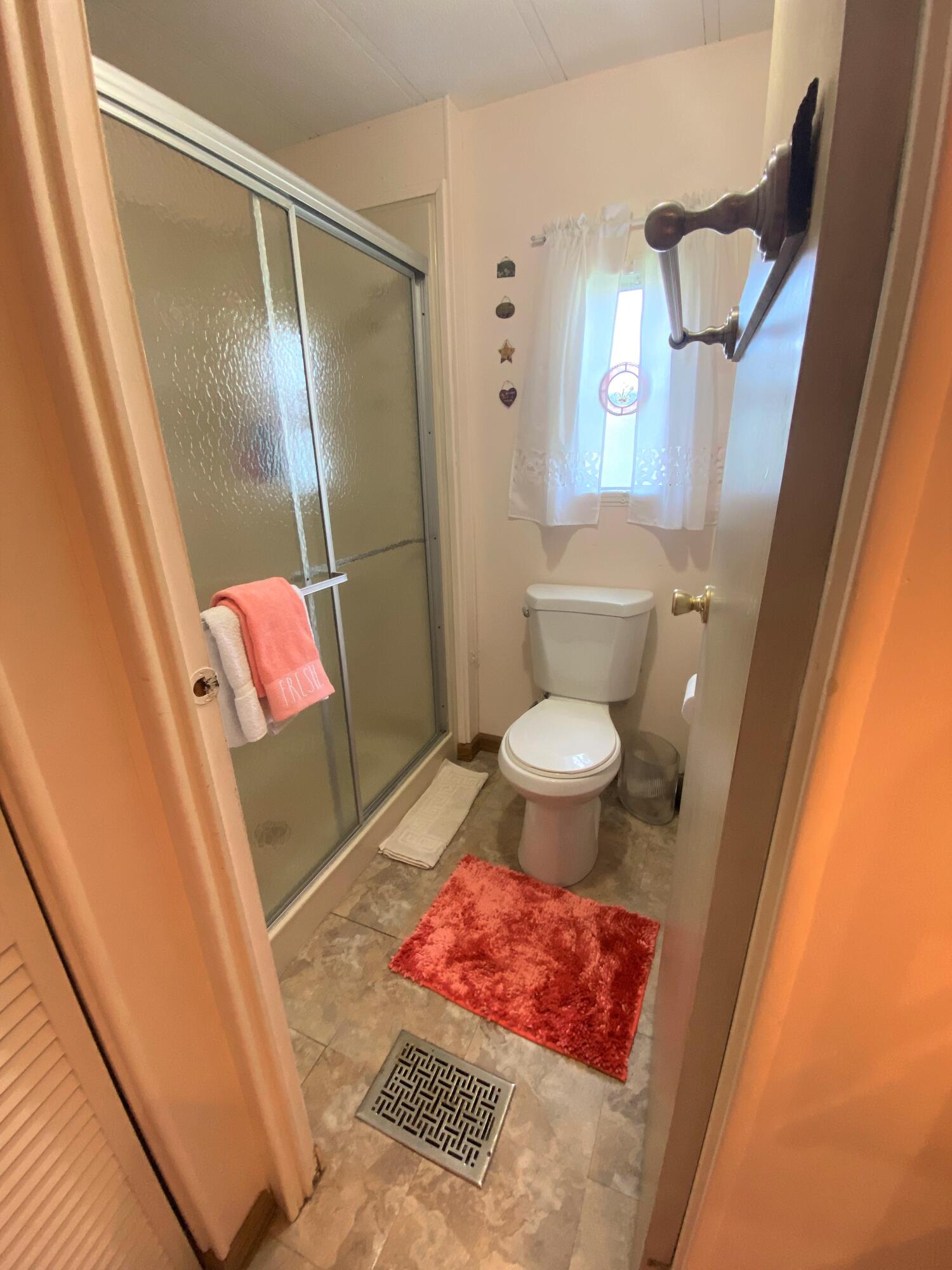 808 South Silver Circle Key Largo, FL 33037 - Photo 12 of 24 a bathroom with a sink and a mirror