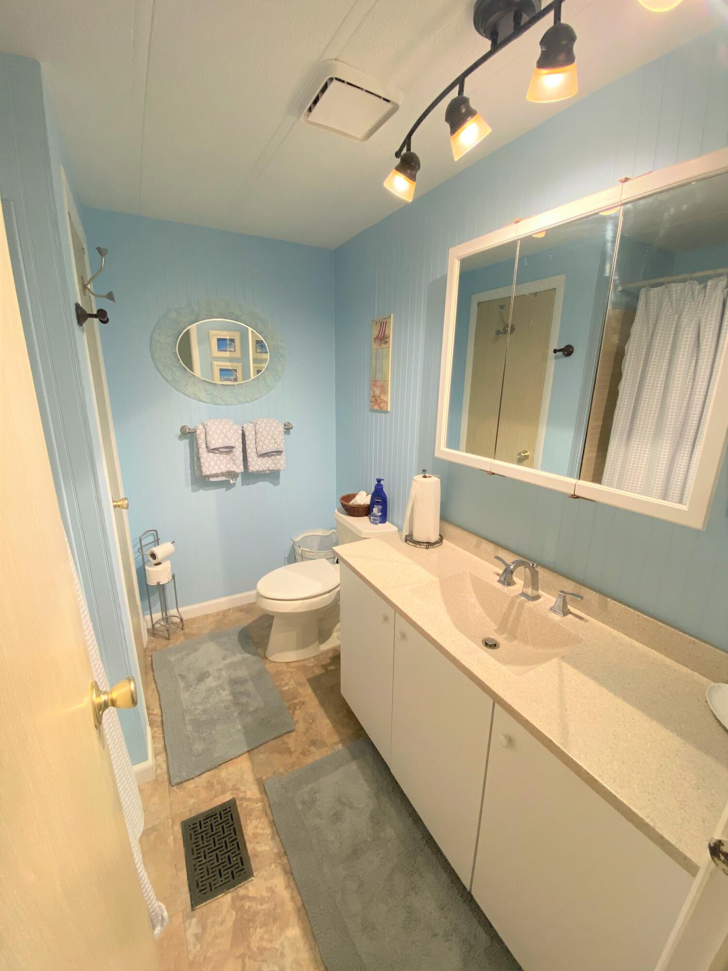 808 South Silver Circle Key Largo, FL 33037 - Photo 14 of 24 a bathroom with a sink a vanity and a bathtub