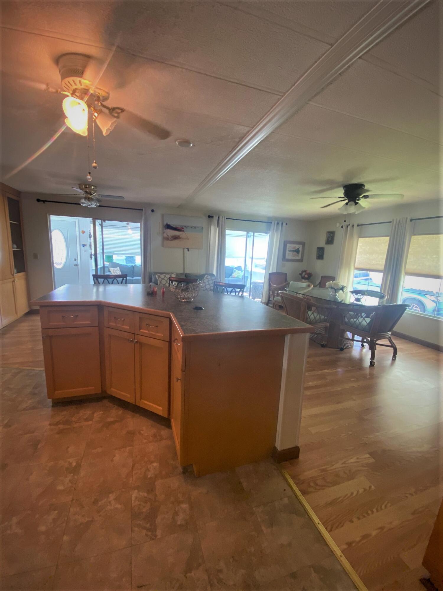 808 South Silver Circle Key Largo, FL 33037 - Photo 23 of 24 a kitchen with stainless steel appliances granite countertop a sink counter space cabinets and a fireplace