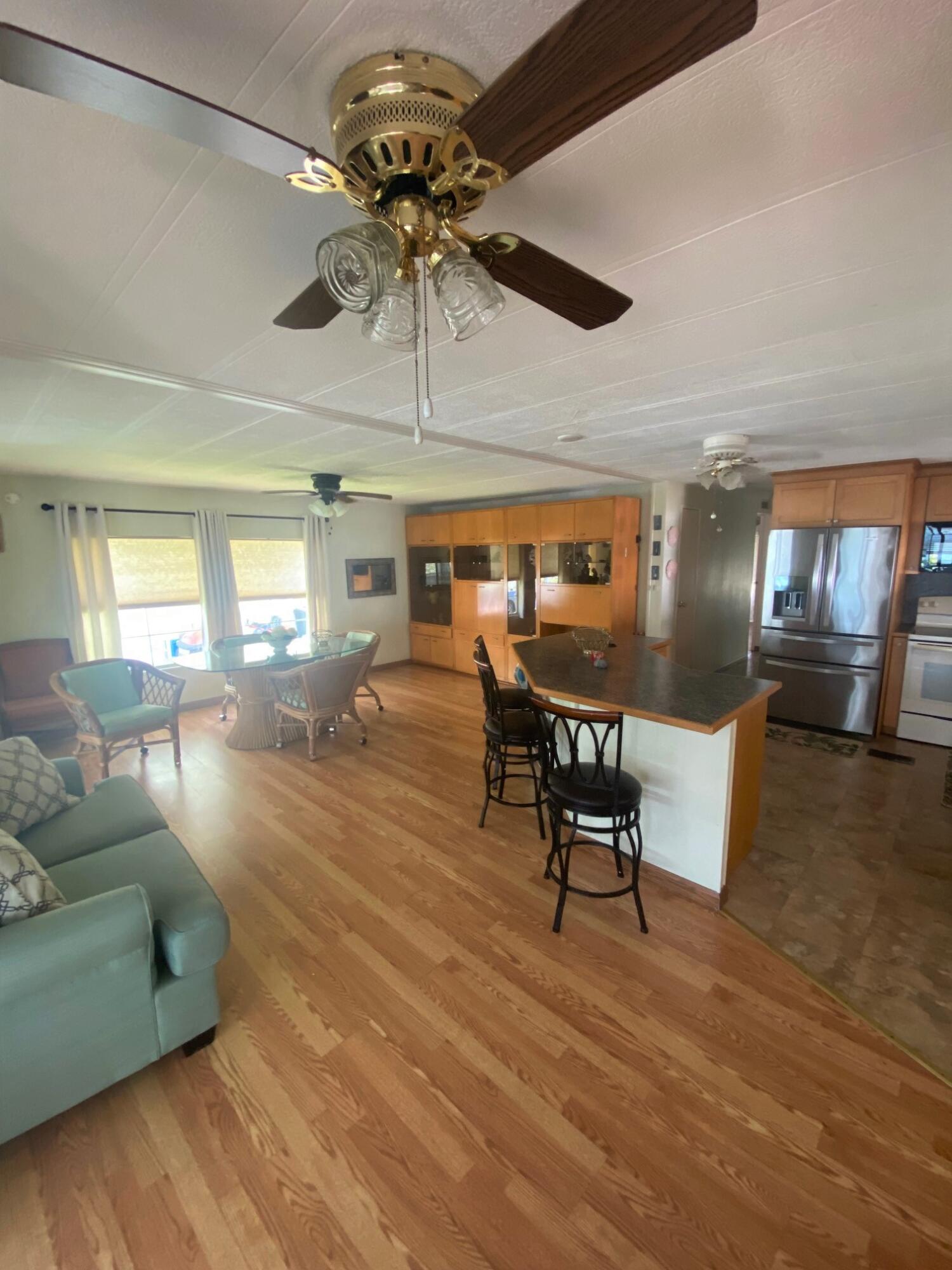 808 South Silver Circle Key Largo, FL 33037 - Photo 24 of 24 a living room with furniture and a chandelier