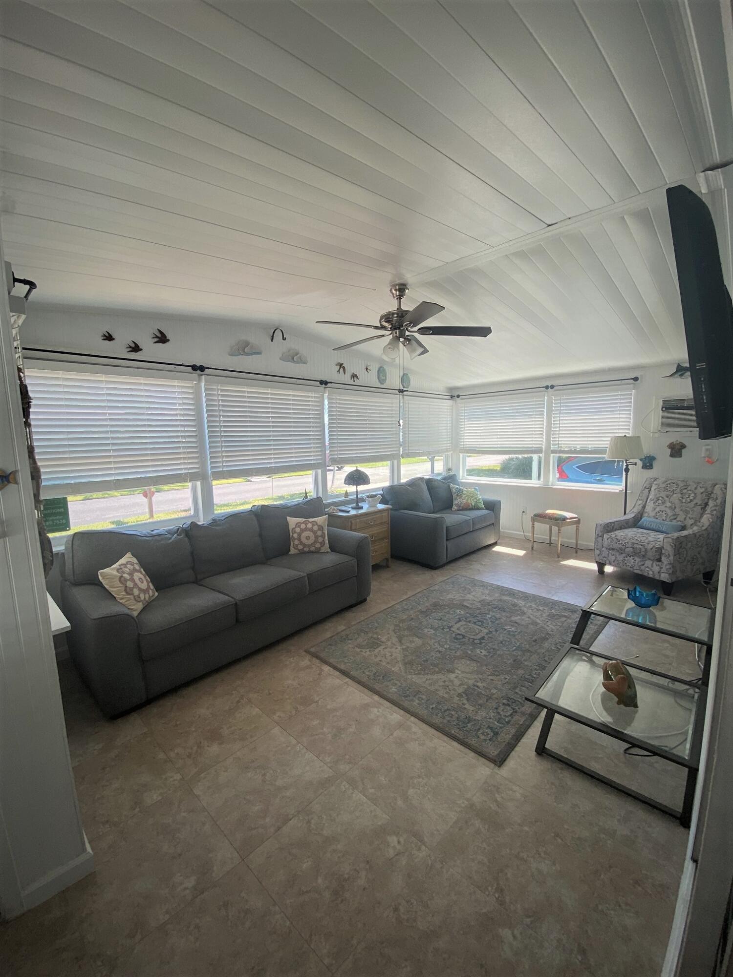808 South Silver Circle Key Largo, FL 33037 - Photo 3 of 24 a living room with furniture and a flat screen tv