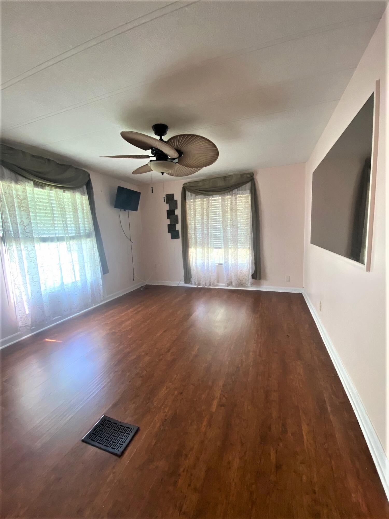 808 South Silver Circle Key Largo, FL 33037 - Photo 10 of 24 an empty room with windows and ceiling fan