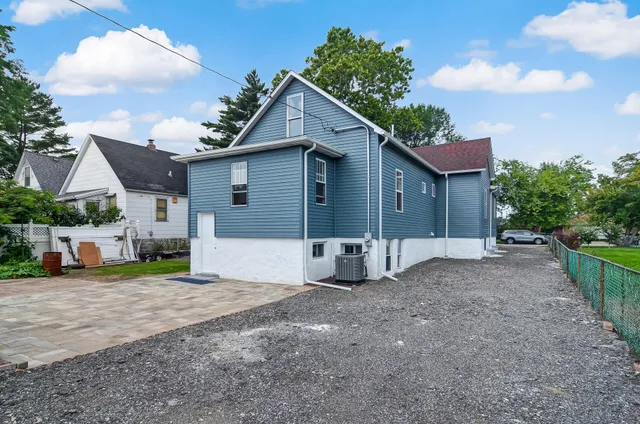 a view of a house with a yard and garage