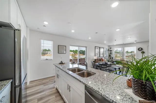 a kitchen with sink refrigerator and outdoor view