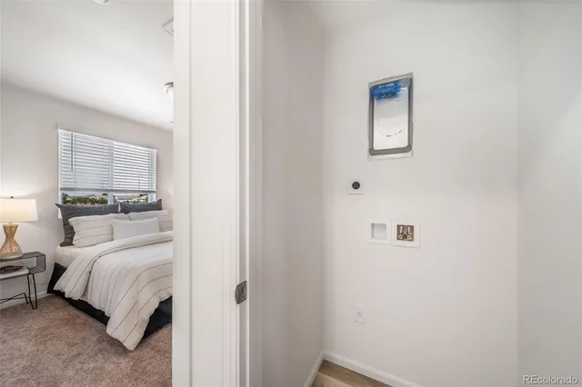 a bathroom with a granite countertop tub sink and mirror