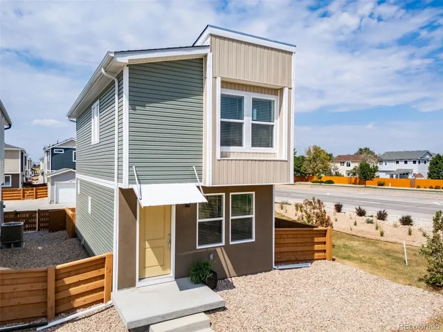 a front view of a house with outdoor space