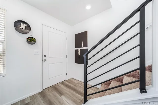 a view of entryway with wooden floor