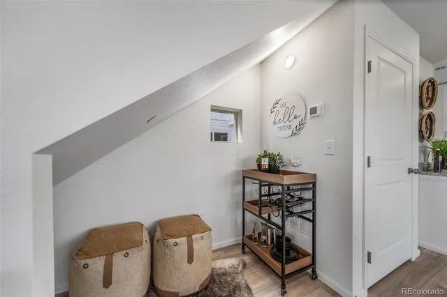 a view of a hallway with paintings on the wall