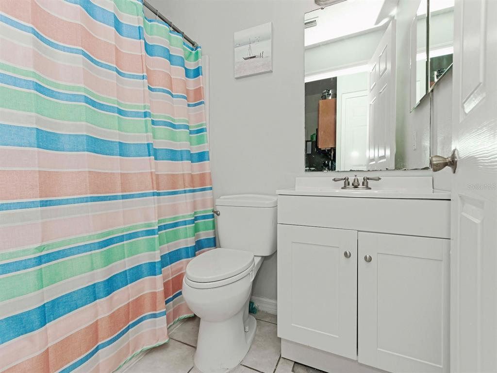 6936 Needle Point Drive Orlando, FL 32822 - Photo 17 of 29 a bathroom with a sink a toilet and shower