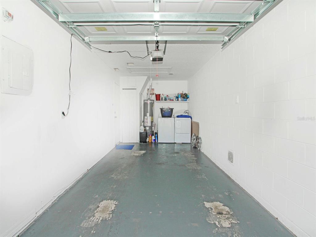 6936 Needle Point Drive Orlando, FL 32822 - Photo 19 of 29 a view of storage and utility room with stairs