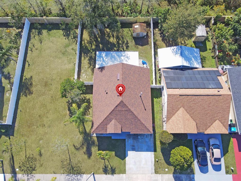 6936 Needle Point Drive Orlando, FL 32822 - Photo 24 of 29 an aerial view of a house with a yard and a large tree