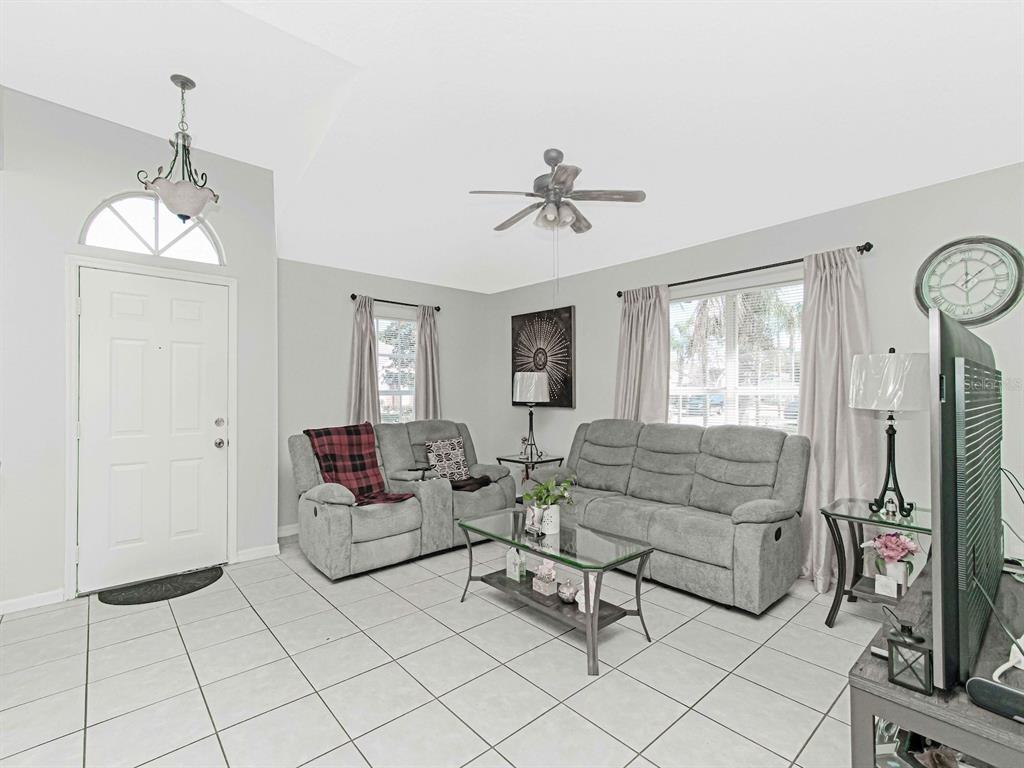 6936 Needle Point Drive Orlando, FL 32822 - Photo 4 of 29 a living room with furniture and a window