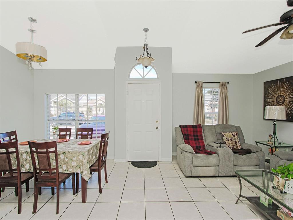 6936 Needle Point Drive Orlando, FL 32822 - Photo 6 of 29 a dining room with furniture and window