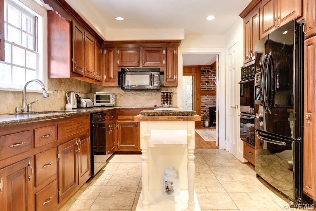 10300 Apache Road Richmond, VA 23235 - Photo 15 of 48 a kitchen with stainless steel appliances granite countertop a refrigerator stove and sink