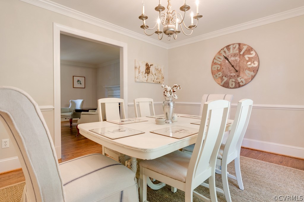 10300 Apache Road Richmond, VA 23235 - Photo 21 of 48 a view of a dining room with furniture and wooden floor