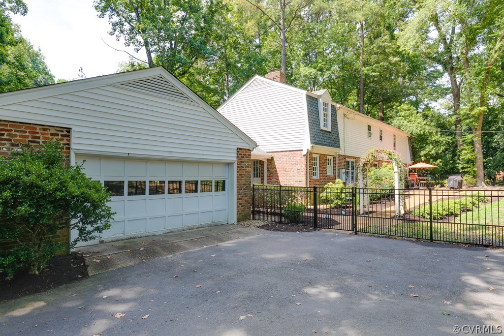 10300 Apache Road Richmond, VA 23235 - Photo 23 of 48 a view of a house with a yard and fence
