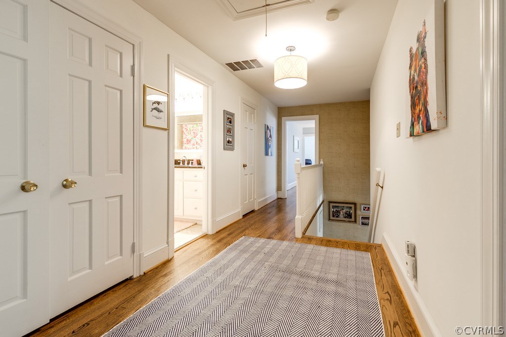10300 Apache Road Richmond, VA 23235 - Photo 29 of 48 a view of a hallway with wooden floor and a living room